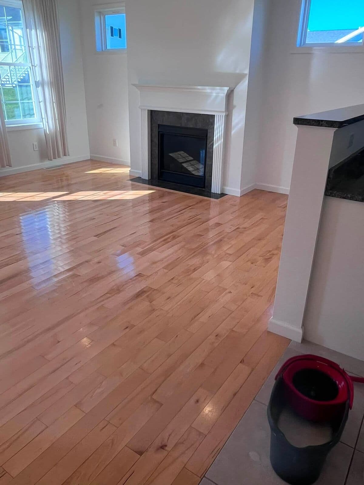 Empty room with gleaming floors after a move-out clean