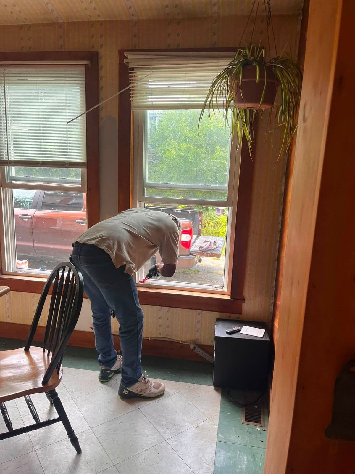 Crew member vacuuming a bedroom